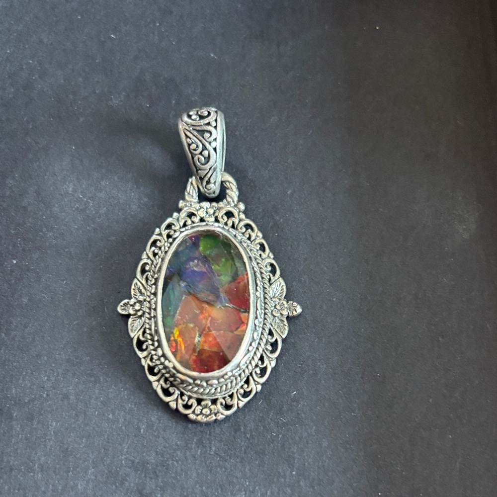 Sarda .925 Artisans of Bali faceted Ammonite  filagree and floral design pendant